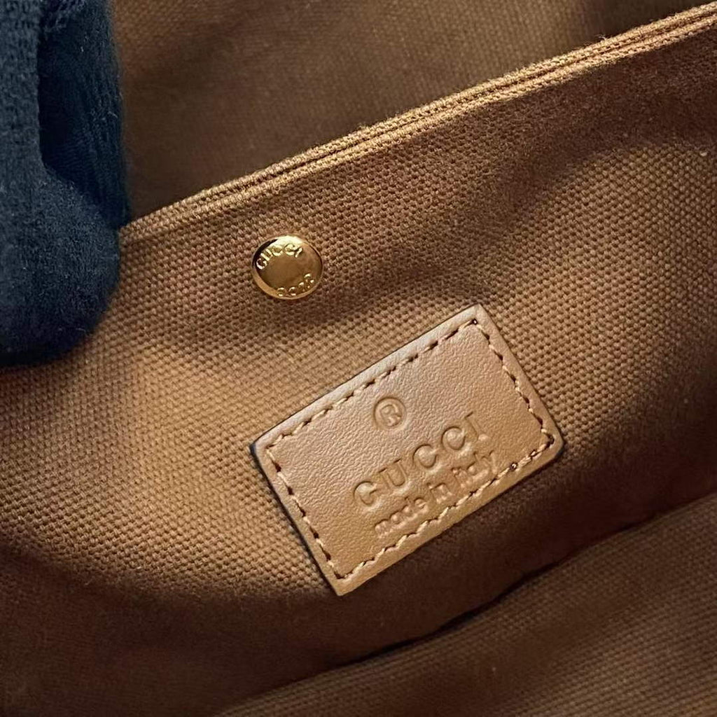 Gucci GG Emblem small bucket bag 815118 in GG brown leather